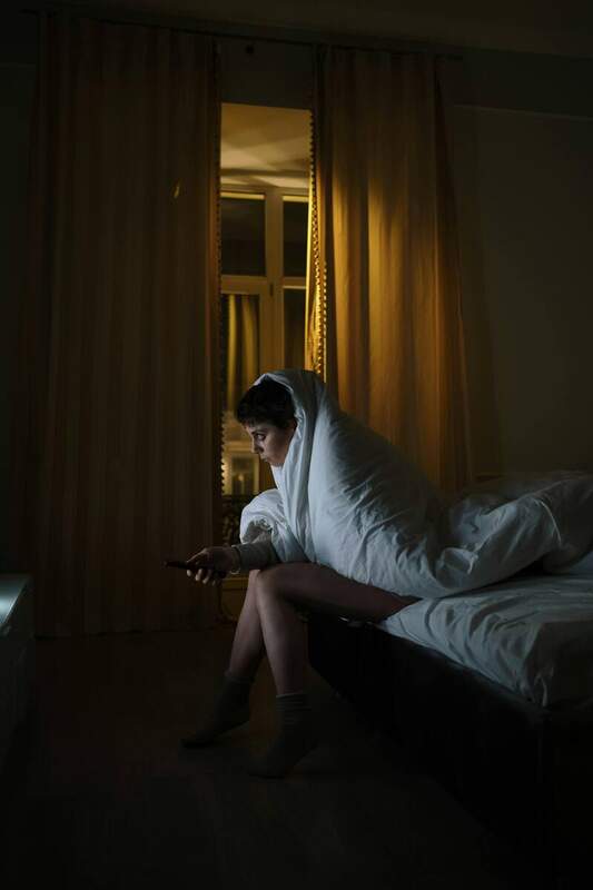 Woman awake at 3am with perimenopause insomnia